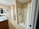 Main bathroom with a walk-in shower and tiled flooring at 17483 Se 74Th Netherclift Ter, The Villages, FL 32162