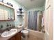 Clean bathroom with tub shower combination at 17483 Se 74Th Netherclift Ter, The Villages, FL 32162