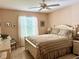 Bedroom with a full-size bed and window seating at 17483 Se 74Th Netherclift Ter, The Villages, FL 32162