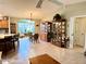 Bright dining area with wood hutch and view into kitchen at 17483 Se 74Th Netherclift Ter, The Villages, FL 32162