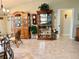 Dining area with wood cabinets and a view to the kitchen at 17483 Se 74Th Netherclift Ter, The Villages, FL 32162