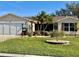 One-story home with a screened patio and lush landscaping at 17483 Se 74Th Netherclift Ter, The Villages, FL 32162