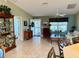 Living room with comfortable seating and a view to the entryway at 17483 Se 74Th Netherclift Ter, The Villages, FL 32162