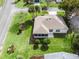 House with surrounding landscape and neighborhood view at 2001 Cordero Ct, The Villages, FL 32159
