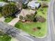 House nestled in a residential community with tree-lined streets at 2001 Cordero Ct, The Villages, FL 32159