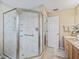 Clean bathroom with a large glass shower and neutral tile at 2001 Cordero Ct, The Villages, FL 32159