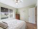 Bright bedroom with double bed, dresser, and large window at 2001 Cordero Ct, The Villages, FL 32159