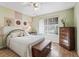 Charming bedroom with unique wall decor and a comfortable bed at 2001 Cordero Ct, The Villages, FL 32159