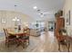Open dining room features a wood table and hardwood floors at 2001 Cordero Ct, The Villages, FL 32159