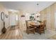 Elegant dining room with a wood table and neutral color scheme at 2001 Cordero Ct, The Villages, FL 32159
