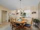 Dining room features a wood table and access to the kitchen at 2001 Cordero Ct, The Villages, FL 32159