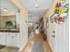 Bright and airy entryway leading to the kitchen and living room at 2001 Cordero Ct, The Villages, FL 32159