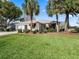 Single-story house with a neatly landscaped front yard and driveway at 2001 Cordero Ct, The Villages, FL 32159