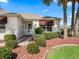 Inviting front entrance with mature landscaping and red mulch at 2001 Cordero Ct, The Villages, FL 32159