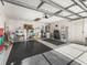 Two-car garage with epoxy flooring and ample storage space at 2001 Cordero Ct, The Villages, FL 32159