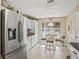 Bright kitchen features stainless steel appliances and white cabinets at 2001 Cordero Ct, The Villages, FL 32159
