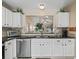 Kitchen boasts granite countertops and white cabinets at 2001 Cordero Ct, The Villages, FL 32159