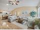 Spacious living area featuring hardwood floors, ample seating, and an open floor plan at 2001 Cordero Ct, The Villages, FL 32159