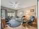 Home office featuring a desk, comfortable seating, and access to a screened porch at 2001 Cordero Ct, The Villages, FL 32159