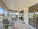 Bright sunroom with seating and dining areas, offering a view of the outdoors at 2001 Cordero Ct, The Villages, FL 32159