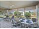 Spacious sunroom with ample seating and dining for entertaining at 2001 Cordero Ct, The Villages, FL 32159