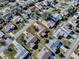 Aerial view of a single Gathering home with a large backyard and two-car driveway at 2009 Claudio Ln, The Villages, FL 32159