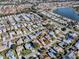 Aerial view of a house surrounded by other houses and green spaces at 2009 Claudio Ln, The Villages, FL 32159