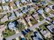 An aerial view of a house nestled in a quiet residential neighborhood at 2009 Claudio Ln, The Villages, FL 32159