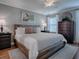 Main bedroom with a king-size bed and wood frame at 2009 Claudio Ln, The Villages, FL 32159