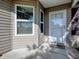 White front door with sidelights and a welcome mat at 2009 Claudio Ln, The Villages, FL 32159