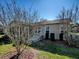 House exterior with a patio and well-maintained landscaping at 2009 Claudio Ln, The Villages, FL 32159