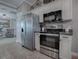 Modern kitchen features stainless steel appliances and ample counter space at 2009 Claudio Ln, The Villages, FL 32159