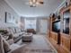 Living room with hardwood floors, large windows and neutral decor at 2009 Claudio Ln, The Villages, FL 32159