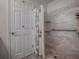 Walk-in shower with tiled walls and safety features at 2009 Claudio Ln, The Villages, FL 32159