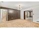 Dining room with wood paneling and chandelier at 2010 Hollywood Dr, Leesburg, FL 34748