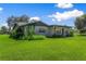 Ranch-style home with mature landscaping and large yard at 2010 Hollywood Dr, Leesburg, FL 34748