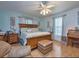 Spacious main bedroom with wood flooring and plenty of light at 204 Lori Ct, Umatilla, FL 32784