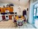 Kitchen dining area with wood table and chairs, offering casual dining at 204 Lori Ct, Umatilla, FL 32784