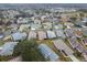 Aerial view of a house and neighborhood at 21122 Lionheart Dr, Leesburg, FL 34748