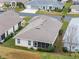 Aerial view showcasing the rear of the house with a screened enclosure at 21122 Lionheart Dr, Leesburg, FL 34748