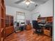 Bright home office with wood flooring and built-in shelving at 21122 Lionheart Dr, Leesburg, FL 34748