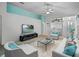 Bright living room featuring modern furniture and a ceiling fan at 21122 Lionheart Dr, Leesburg, FL 34748