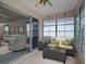 Inviting sunroom with sliding glass doors and wicker furniture, perfect for relaxation and enjoying the outdoors at 21122 Lionheart Dr, Leesburg, FL 34748
