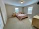 King bed in a well-lit, carpeted bedroom at 2185 Victoria Dr, Davenport, FL 33837