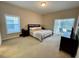 Bedroom with king-size bed and sliding doors leading to a patio at 2185 Victoria Dr, Davenport, FL 33837