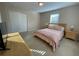 King-size bed in spacious bedroom with light walls at 2185 Victoria Dr, Davenport, FL 33837