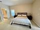 King-size bed in spacious bedroom with an en-suite bathroom at 2185 Victoria Dr, Davenport, FL 33837