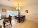 Bright dining room featuring a large table and chandelier at 2185 Victoria Dr, Davenport, FL 33837