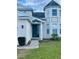 Green front door with a brick pathway leading to the entrance at 2185 Victoria Dr, Davenport, FL 33837