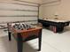 Game room with foosball and air hockey tables at 2185 Victoria Dr, Davenport, FL 33837